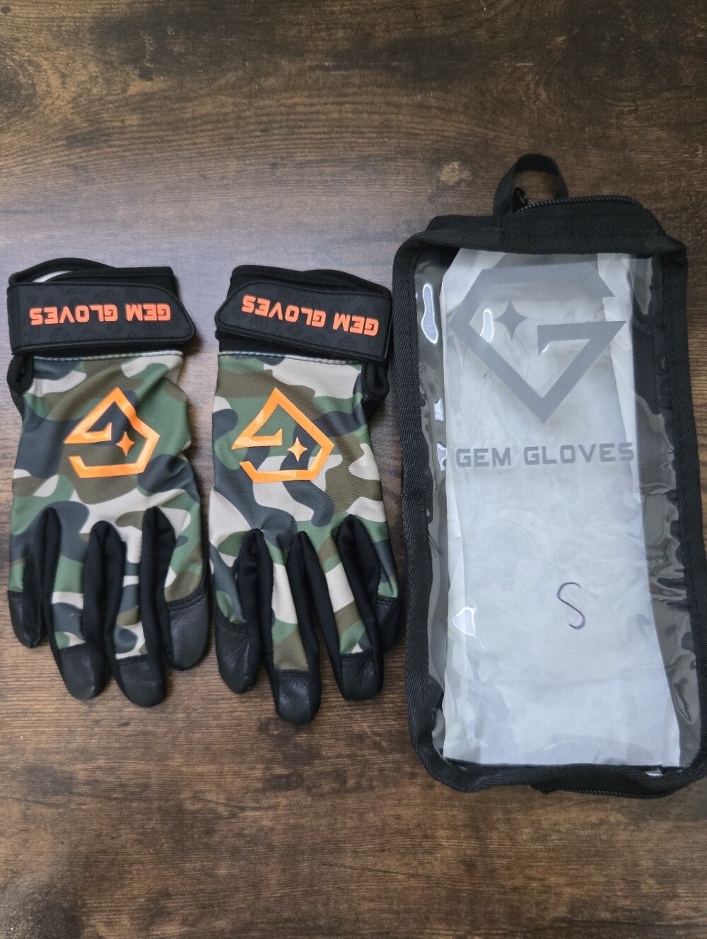 GEM Brand Camo Batting Gloves with Orange Logo.